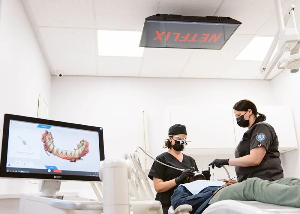 A South African dental team treating a patient